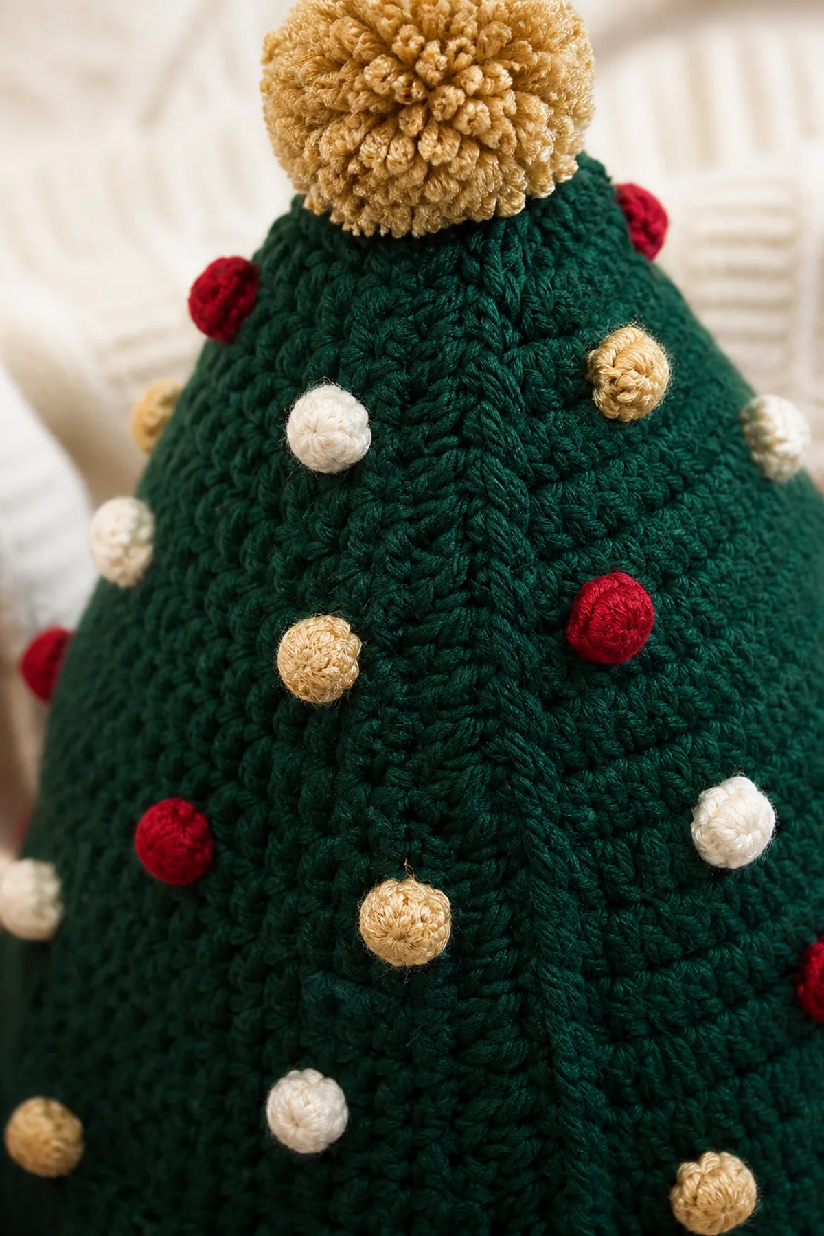 Close view of the stitches and finishing details on the crochet christmas tree hat