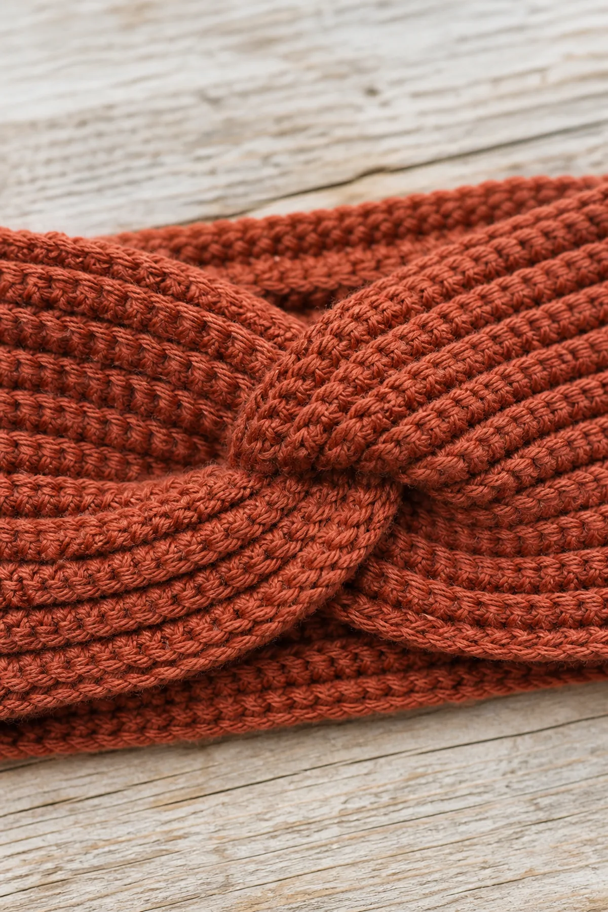 Close view of the stitches and finishing details on the textured crochet fall headband