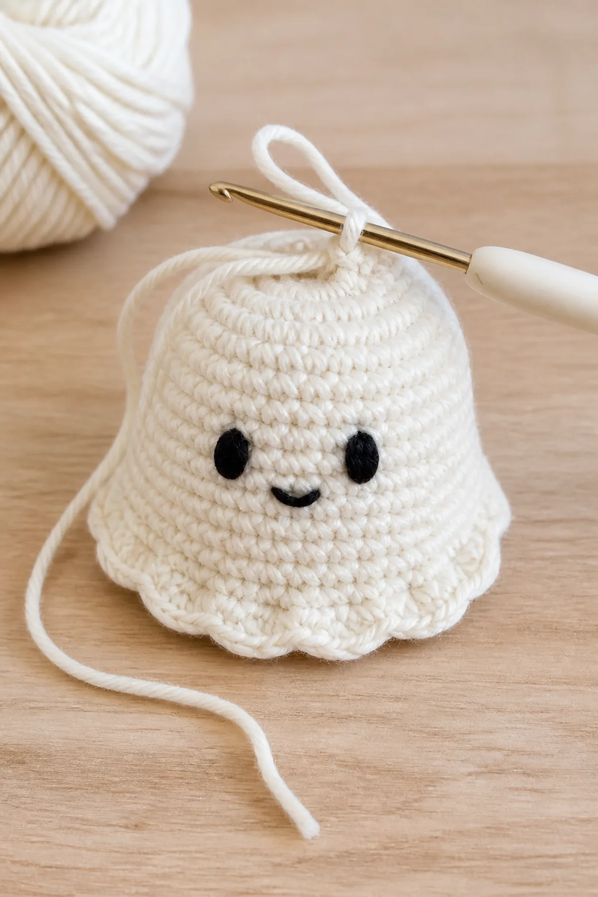 Early crochet construction stage of the crochet ghost amigurumi